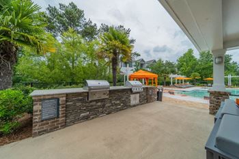 Poolside kitchen with grills and social lounge